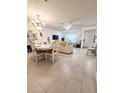 Bright living room with tile floors and comfy seating at 112 Reserve Cir # 104, Oviedo, FL 32765