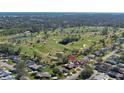 An aerial view showcasing the home's location near a golf course at 839 Fairway Dr, New Smyrna Beach, FL 32168