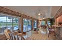 Bright sunroom with pool views, bar seating, and tiled floors at 839 Fairway Dr, New Smyrna Beach, FL 32168