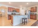 Modern kitchen with island, stainless steel appliances, and granite countertops at 1911 Hollybrooke Rd, Edgewater, FL 32141