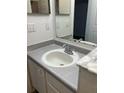 Bathroom with single vanity, sink, and mirrored medicine cabinet at 827 Camargo Way # 307, Altamonte Springs, FL 32714