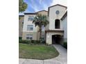 Condo building entrance with stairs and landscaping at 827 Camargo Way # 307, Altamonte Springs, FL 32714