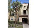 Condo building entrance with stairs and landscaping at 827 Camargo Way # 307, Altamonte Springs, FL 32714