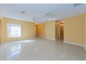 Spacious living room with tile floors and ceiling fans at 5025 E Lake Mary Blvd, Sanford, FL 32771