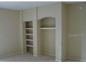 Built-in shelving in a living room, ideal for storage and display at 1321 Arbor Vista Loop # 209, Lake Mary, FL 32746
