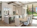 Island kitchen with breakfast bar, stainless steel appliances, and white cabinetry at 4151 Grande Brick Loop # 17, Orlando, FL 32837