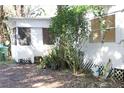 White shed and mobile home with green plants at 770 Snow Hill Rd, Geneva, FL 32732