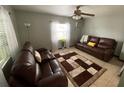 Cozy living room featuring leather sofas and a stylish area rug at 1023 W Gore W St, Orlando, FL 32805