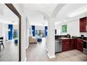 Modern kitchen with dark wood cabinets and granite counters at 14501 Grove Resort Ave # 1430, Winter Garden, FL 34787