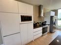 Modern kitchen with stainless steel appliances and ample cabinetry at 7577 Brooklyn Dr, Kissimmee, FL 34747