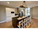 Modern kitchen with large island and stainless steel appliances at 7577 Brooklyn Dr, Kissimmee, FL 34747