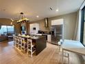 Modern kitchen with large island and stainless steel appliances at 7577 Brooklyn Dr, Kissimmee, FL 34747