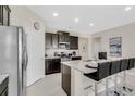 Modern kitchen with granite counters and stainless steel appliances at 5288 Oakbourne Ave, Davenport, FL 33837