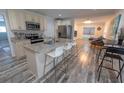 Modern kitchen with granite island and stainless steel appliances at 2627 Ambergate Rd, Winter Park, FL 32792