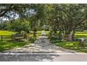Private gated entrance leading to a beautiful home at 10980 Jim Edwards Rd, Haines City, FL 33844