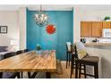 A spacious dining area featuring a long wooden table and bench seating at 8407 Blue Lagoon Dr, Kissimmee, FL 34747