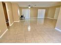 Spacious living room with tile flooring and sliding glass doors at 10401 Larissa St, Orlando, FL 32821