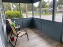 Relaxing screened porch with two chairs at 1037 S Adelle Ave, Deland, FL 32720