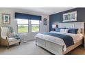 Main bedroom with king-size bed and calming decor at 2452 Dubai St, Kissimmee, FL 34747