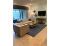 Living room with light wood furniture and blue rug at 2452 Dubai St, Kissimmee, FL 34747
