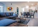 Open concept dining area with table and chairs, adjacent to kitchen at 8879 Cabot Cliffs Dr # 102, Davenport, FL 33896