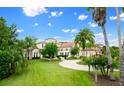 House with manicured lawn and palm trees at 2357 Alaqua Dr, Longwood, FL 32779