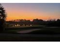 Sunrise over the golf course and pond at 9447 Myrtle Creek Ln # 112, Orlando, FL 32832
