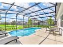 Enjoy the screened pool and patio with views of the community at 330 Ballo Dr, Kissimmee, FL 34746