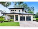 Two-story modern home with two-car garage and landscaped yard at 1871 Taylor Ave, Winter Park, FL 32789