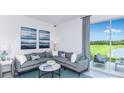 Living area with water view and comfy couch at 4831 Spangle Drive Way, St Cloud, FL 34769