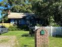 Charming house with white picket fence and brick mailbox at 2009 Oglesby Ave, Winter Park, FL 32789