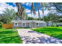 Newly renovated home with teal front door and a brick driveway at 278 Debary Dr, Debary, FL 32713