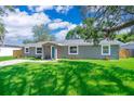 Newly built home with a teal front door and spacious lawn at 278 Debary Dr, Debary, FL 32713