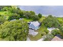 Lakefront property with a large house and expansive backyard at 1317 Spring Lake Ter, Ocoee, FL 34761