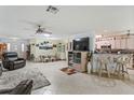 Spacious living room with adjacent kitchen and dining area at 9656 Sw 93Rd Loop, Ocala, FL 34481