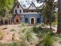 Front view of a distinctive blue and white home with a stone and stucco facade at 13857 Marine Dr, Orlando, FL 32832