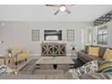 Living Room with large TV, comfy sofas and coffee table at 9025 Sunshine Ridge Loop, Kissimmee, FL 34747