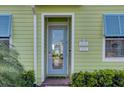 Inviting entryway with light blue door and stylish address plaque at 8035 Knee Deep Rd, Kissimmee, FL 34747