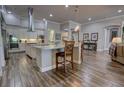 Island kitchen with hardwood floors and stainless steel appliances at 5769 Saybrook Cir, Sanford, FL 32771