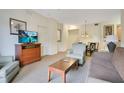 Living room with sofa, chairs, and a TV at 8100 Poinciana Blvd # 2212, Orlando, FL 32821