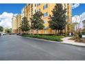 Building exterior with landscaping and parking at 8100 Poinciana Blvd # 2212, Orlando, FL 32821