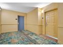 Building hallway with carpet and doors at 8100 Poinciana Blvd # 2212, Orlando, FL 32821