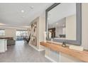 Bright entryway with a large mirror and a long wooden console table at 4509 Target Blvd, Kissimmee, FL 34746