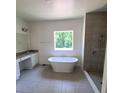 Main bathroom boasts a large soaking tub and walk-in shower at 605 N Boundary Ave, Deland, FL 32720