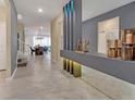 Bright entryway with gray wall, tiled floor, and modern decor at 2126 Lelani Cir, Davenport, FL 33897