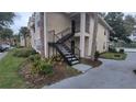 Two-story condo building with exterior stairs and parking at 1069 S Hiawassee Rd # 1317, Orlando, FL 32835