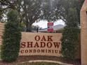 Oak Shadow Condominium entrance with gated access at 2860 N Powers Dr # 14, Orlando, FL 32818