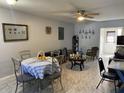 Dining area with table and chairs, open to living room at 241 N Hill Ave, Deland, FL 32724