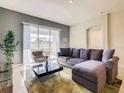 Spacious living room with comfortable sectional sofa and large TV at 619 Ocean Course Ave # 619, Davenport, FL 33896