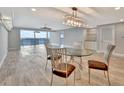 Bright dining room with glass table and water views at 645 Marina Point Dr # 6450, Daytona Beach, FL 32114
